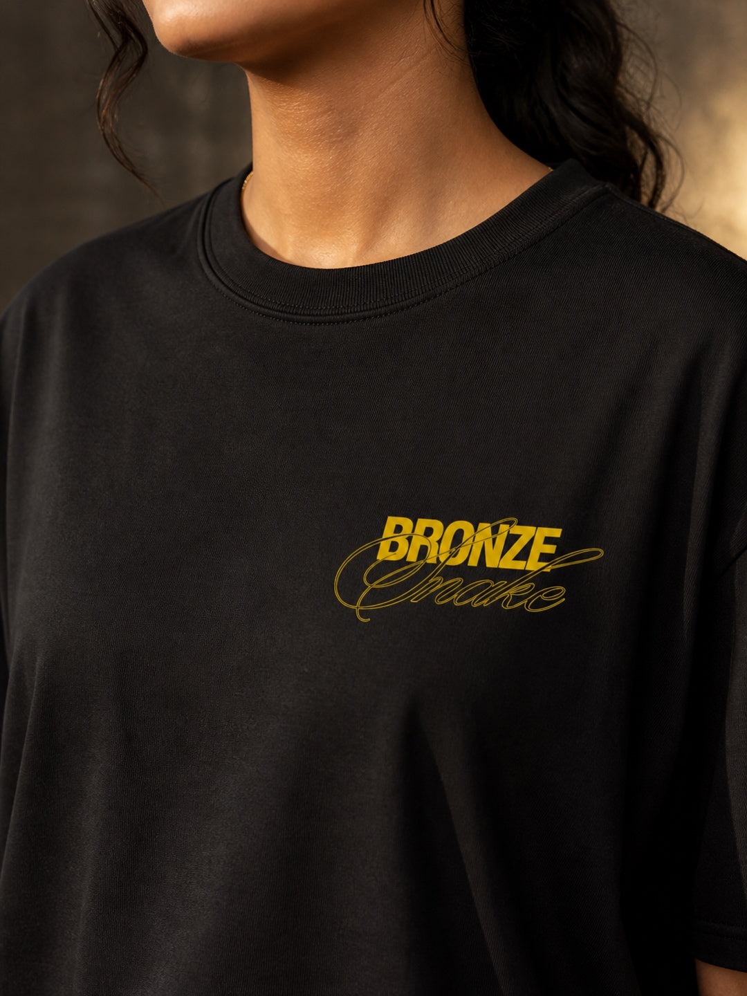 TEEVYBE Women’s Black Oversized T-Shirt with Bronze Snake Graphic Print