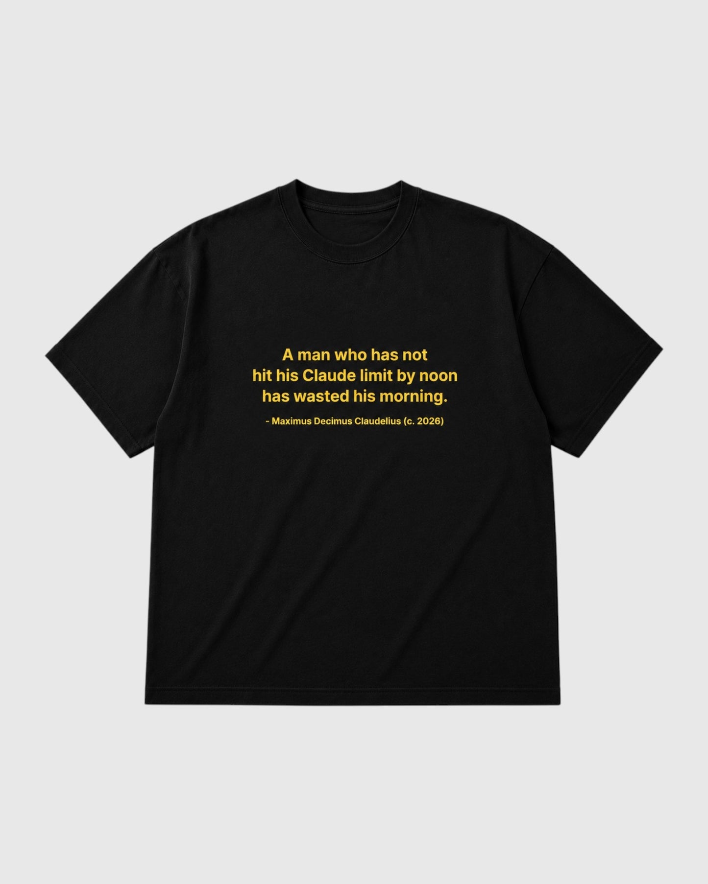 A black short-sleeve crewneck t-shirt with a yellow printed quote on the chest, displayed flat against a light gray background.