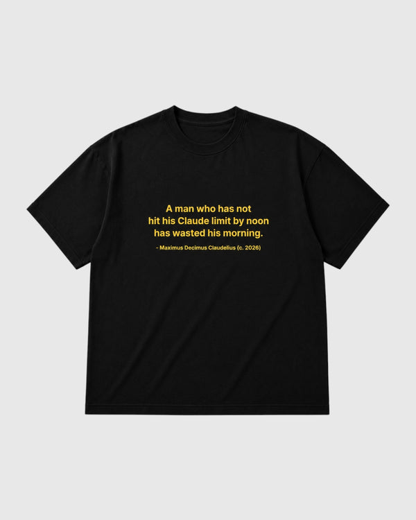 A black short-sleeve crewneck t-shirt with a yellow printed quote on the chest, displayed flat against a light gray background.